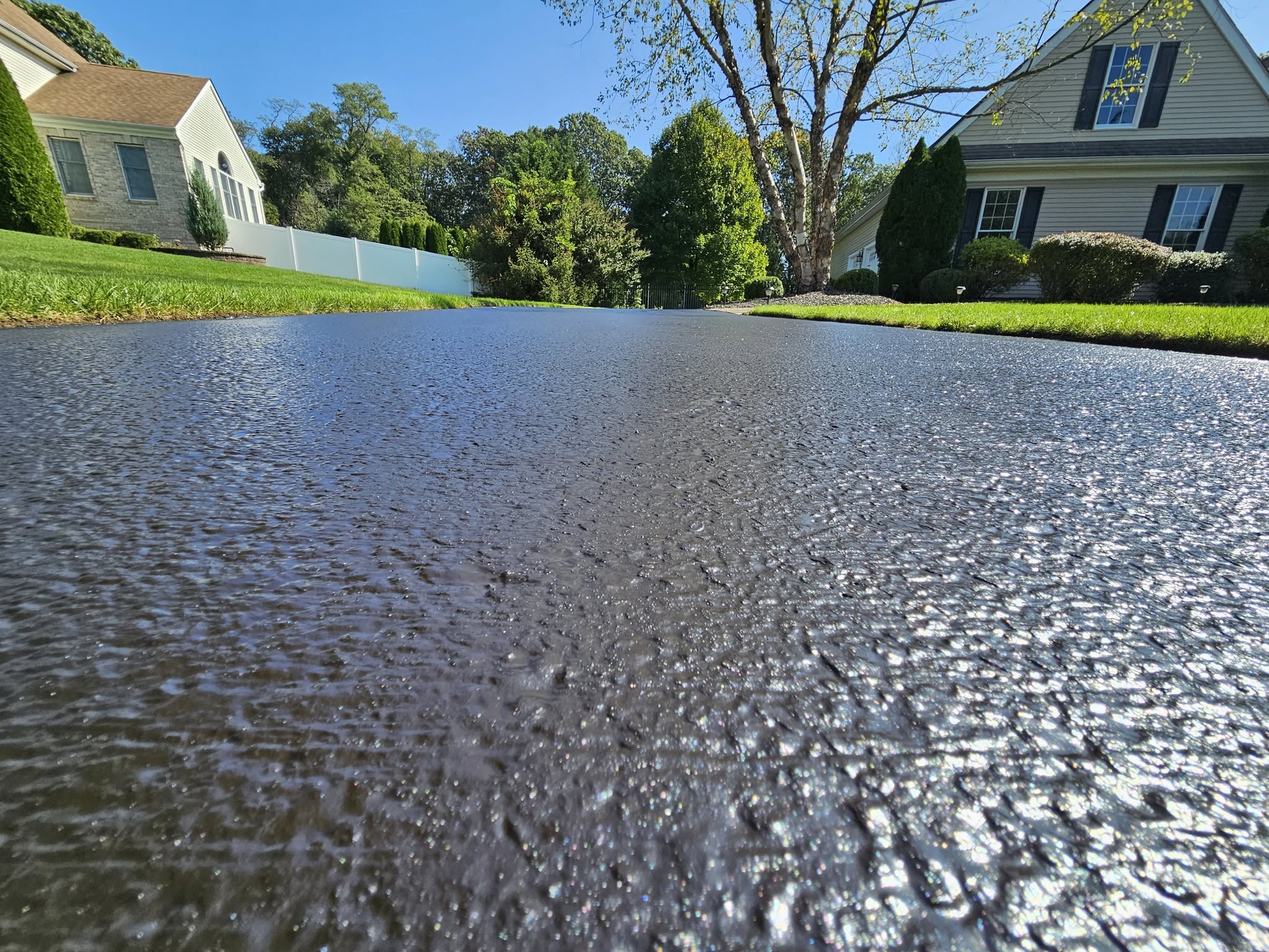Crackfilled and sealcoated driveway protected against water intrusion