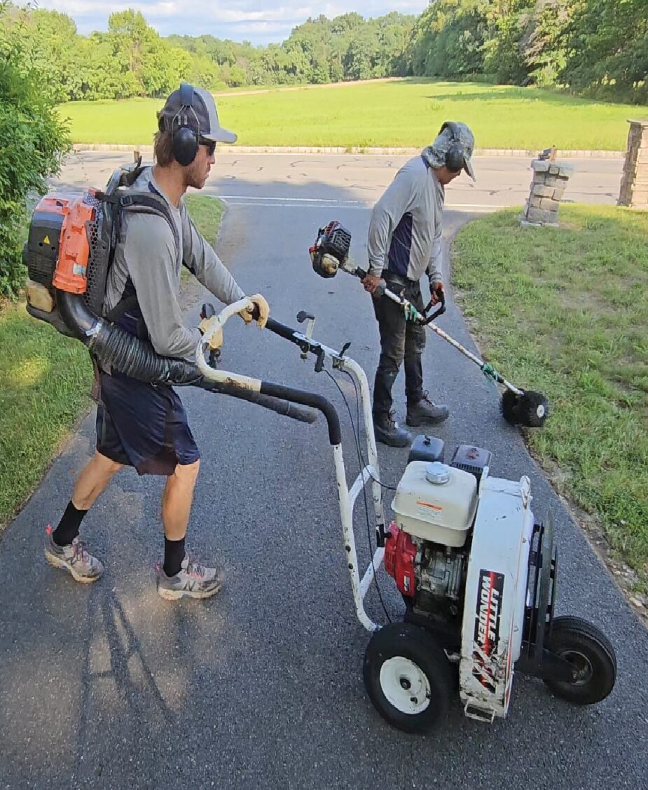 Power cleaning and prepping asphalt driveway before sealcoating
